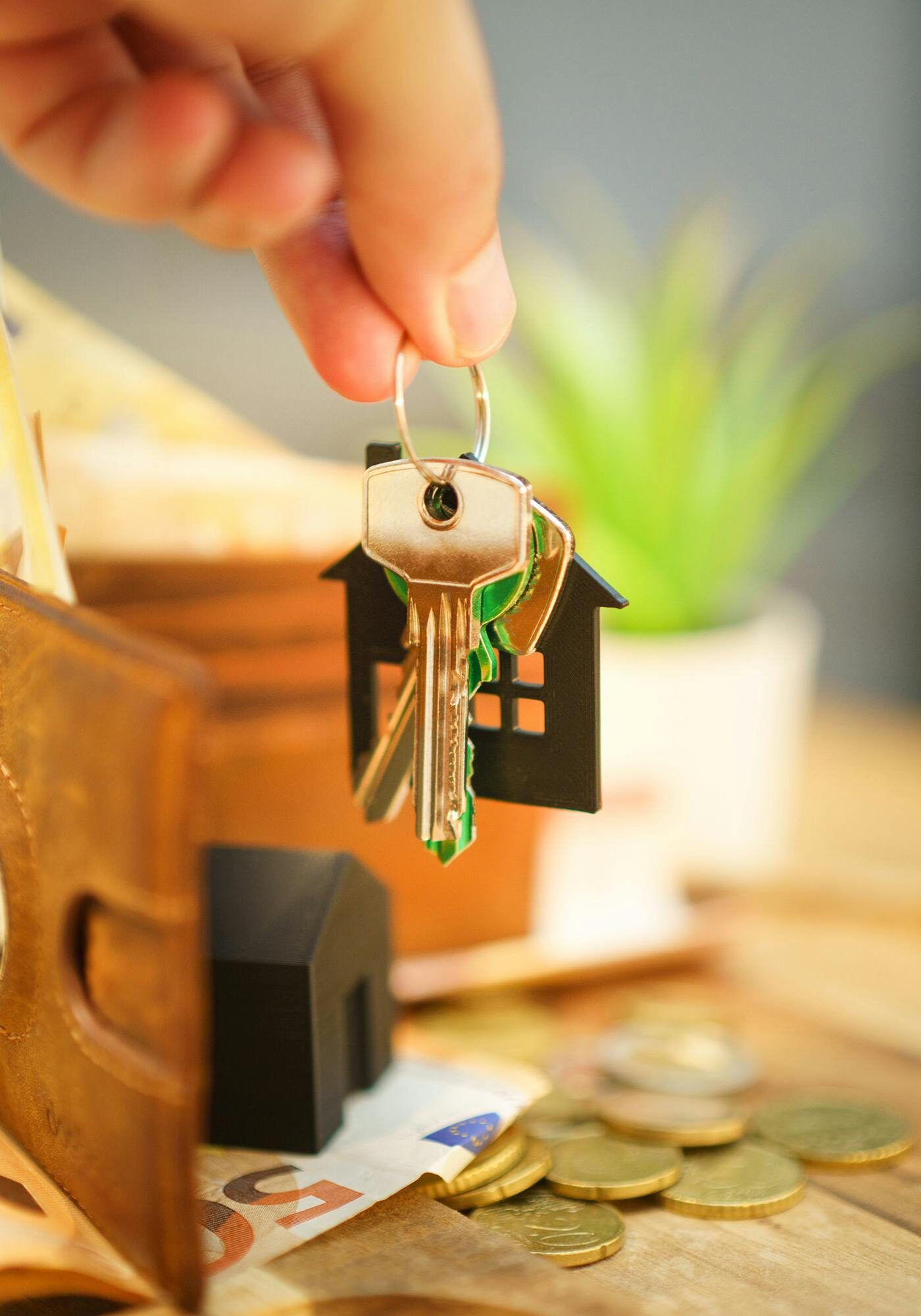 Property management staff holding a key for a house in Northwest IN.
